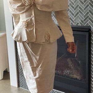 Raw silk suit.  Pencil skirt and peplum jacket.  Cream colored.